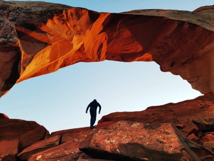 person-standing-on-a-rock-formation-3624336