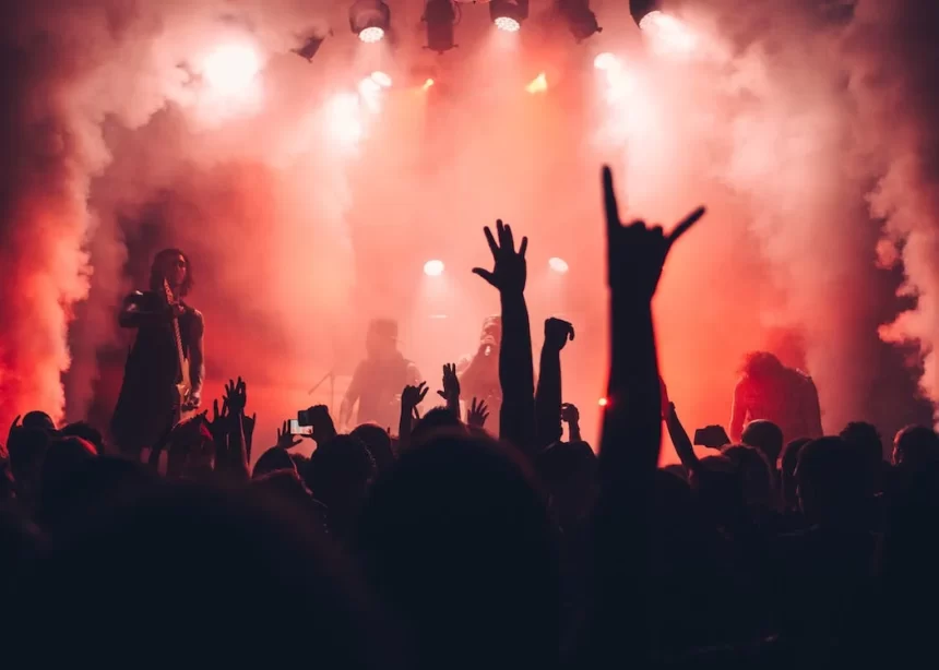 People enjoy and dance in one of the Vancouver nightclubs, with lights all over the place.