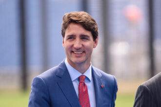 A picture of Prime Minister of Canada, Justin Trudeau smiling. Justin Trudeau's Heartwarming Tweet on Mother's Day!