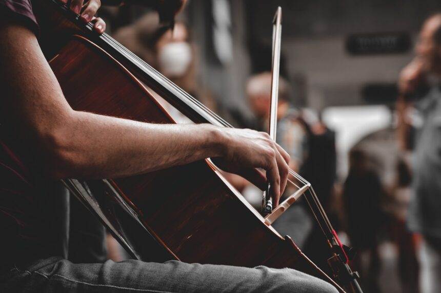 A close-up of a person playing the violin.