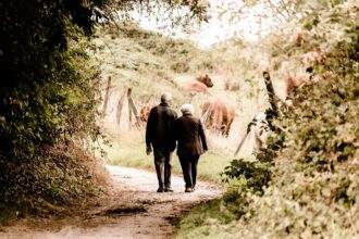 An elderly couple walking