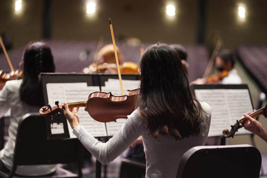 A group of musicians performing violin in front of an audience. The Best of Zelda by Candlelight is coming to Toronto this September.