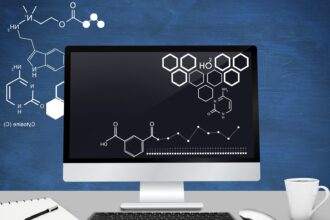 Computer desk with H2O formula displaying on it.