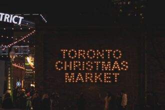 Toronto Christmas Market is written with sparkling lights.