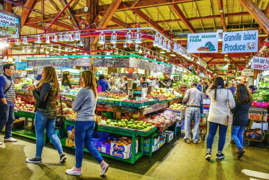 People buy vegetables in the farmers market in Vancouver.