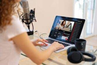 Close up of a women recording a podcast in a studio