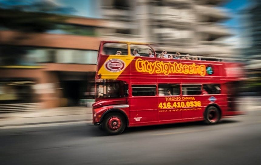 A double-decker bus on the road.