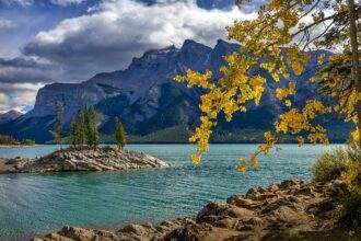 A lake view with mountains in the background.