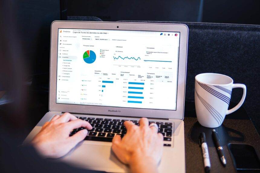 A laptop with data for the advertisement is displayed on the screen.