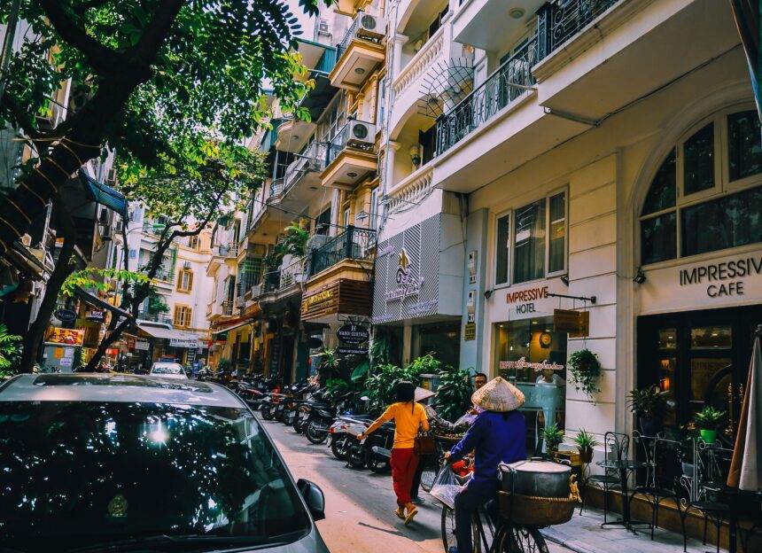 People walking in front of buildings.