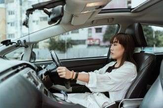 Asian woman driving her car