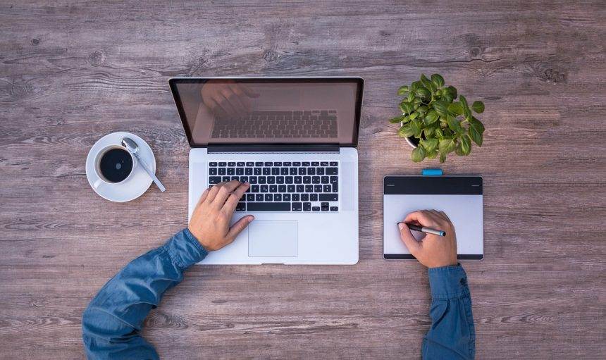 A top view of a person using a laptop for Graphic Designer