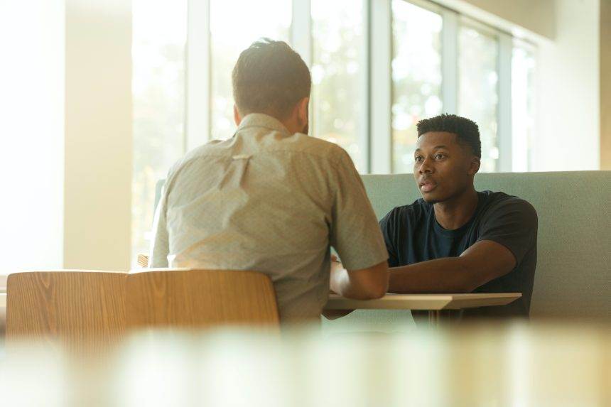 Two man talking to each other