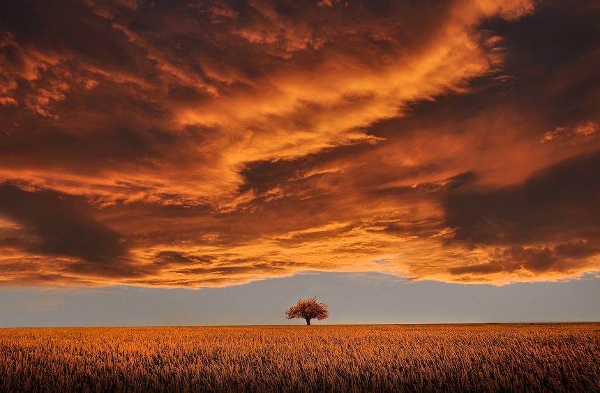 Heavy clouds in the sky with an orange background.