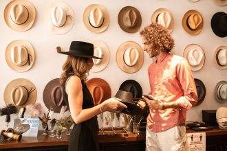 People inside a hat store