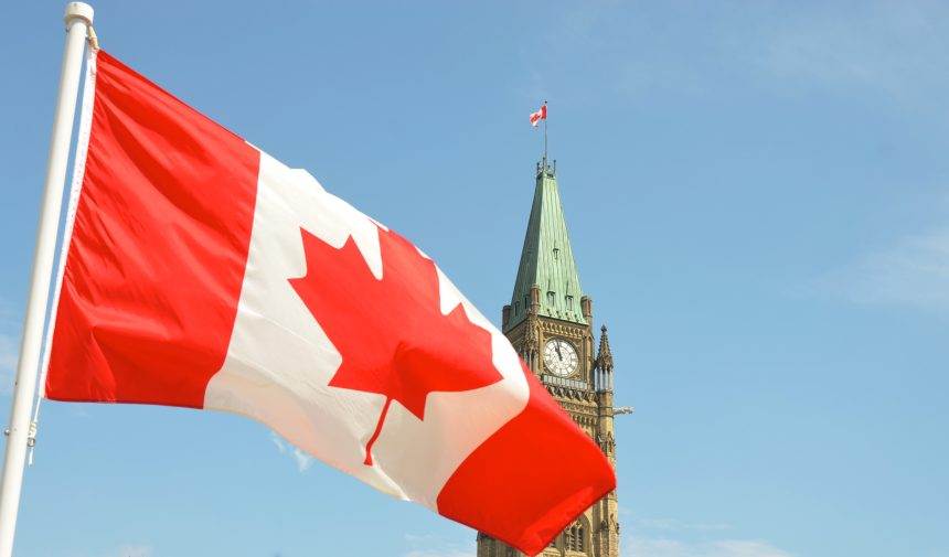 Canadian flag with parliament building backdrop