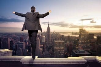 Businessman Embracing Balance and Success on Skyline