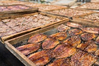 Traditional sun drying process at a fish market.