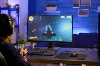 Gamer engaged in online space shooter game competition.