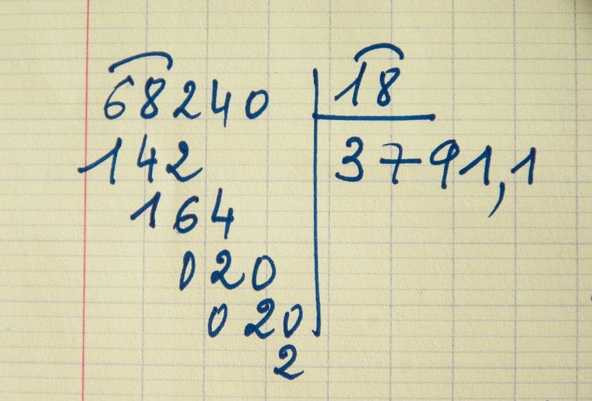 Long division method on lined paper.